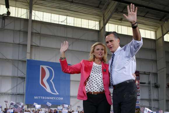 Romney and his wife Ann wave to the crowd at a campaign rally in Colorado Springs, Colorado