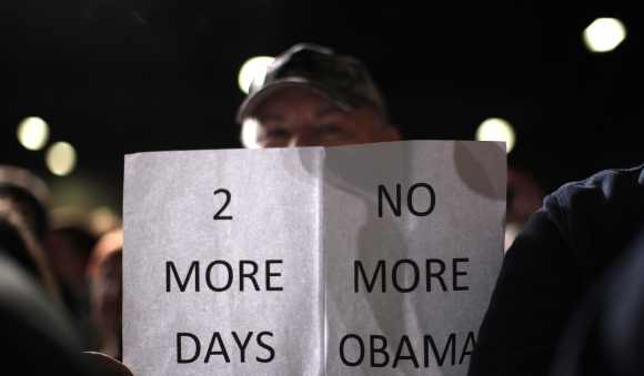 A supporter of Romney attends a campaign rally in Des Moines, Iowa