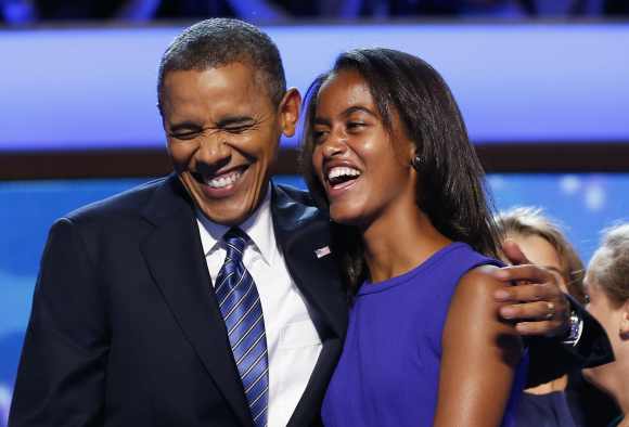 US President Barack Obama celebrates with his daughter Malia after accepting the 2012 USDemocratic presidential nomination in North Carolina