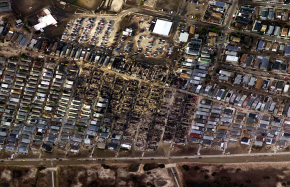 Burnt houses surrounded by houses that survived is seen in the aftermath of Hurricane Sandy in the Breezy Point neighbourhood of Queens, New York