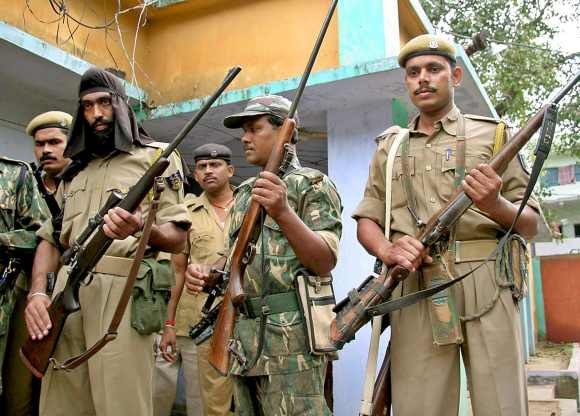 Policemen stand guard in the Gaya area of Bihar