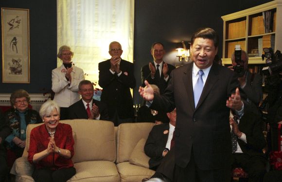 China's Vice President Xi Jinping speaks at the home of Roger and Sarah Lande in Muscatine, Iowa. Xi joked about receiving a gift of popcorn during his first visit to Muscatine in 1985.