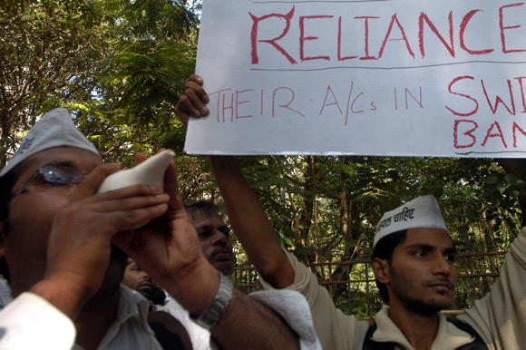 India against Corruption activists raise slogans against the Ambanis outside their south Mumbai residence