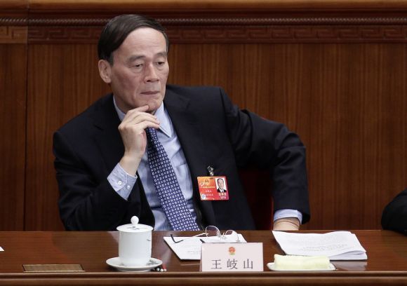 Wang Qishan attends a plenary meeting of the National People's Congress, at the Great Hall of the People in Beijing. Photograph: Jason Lee/Reuters