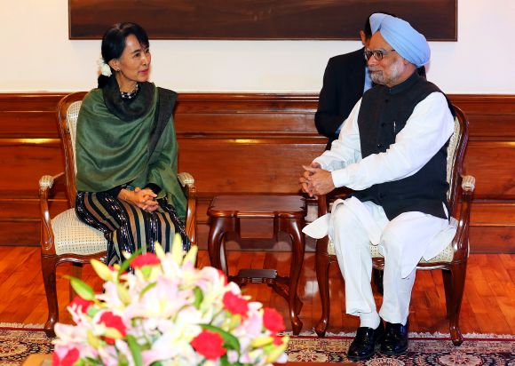 Aung San Suu Kyi speaks with Prime Minister Manmohan Singh during their meeting in New Delhi on Wednesday.