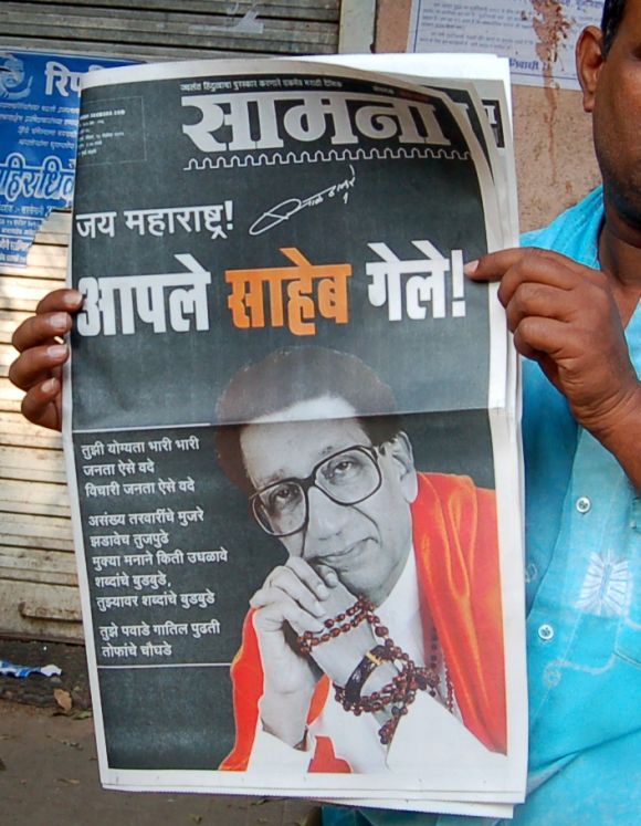 A cop reading the Shiv Sena mouthpiece 'Saamna'