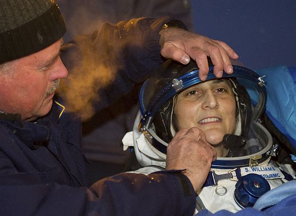 The International Space Station crew member US astronaut Sunita Williams is assisted shortly after landing near the town of Arkalyk, in northern Kazakhstan