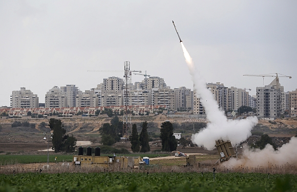 An Iron Dome launcher fires an interceptor rocket near the Israeli city of Ashkelon