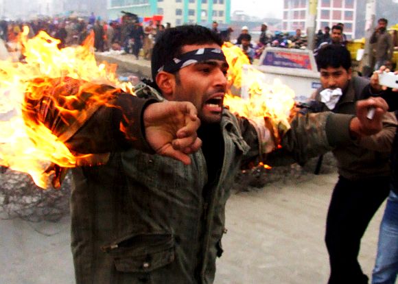 A person sets himself on fire protesting ban on Muharram processions in Srinagar on Friday