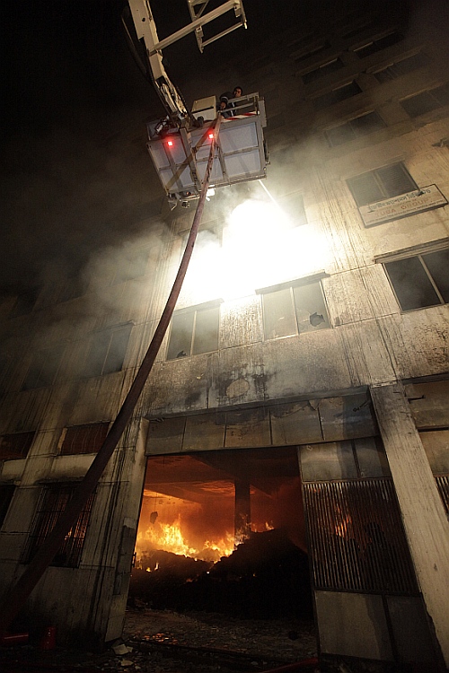 Firefighters try to control a fire in a garment factory in Savar, outskirts of Dhaka