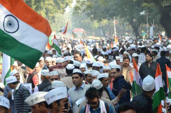 Supporters don the 'aam aadmi' caps as the participate in the rally