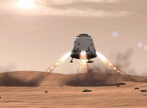 Artist's rendition of a Dragon spacecraft landing on the surface of Mars