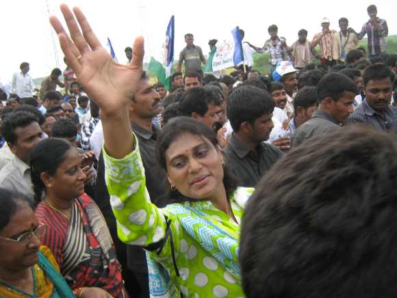 Sharmila waves to supporters during her visit to Telangana