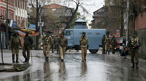 CRPF personnel partol the streets of Srinagar