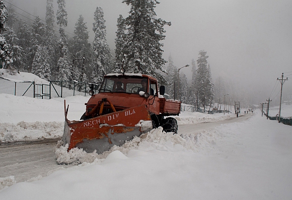 A snow clearing machine in action after the heavy snowfall at Gulmarg