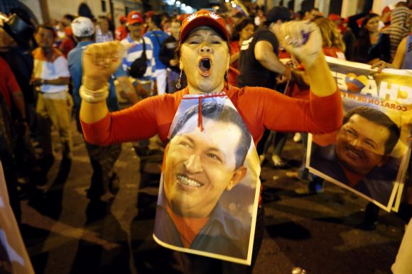 Supporters of Hugo Chavez gather outside Miraflores Palace to wait for the results of presidential elections in Caracas