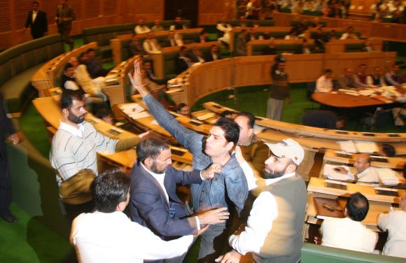 Marshals dragging three protesting youth from J&K assembly on Monday