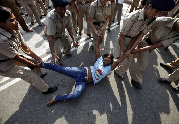 One of Arvind Kejriwal's lady supporters being detained by the police