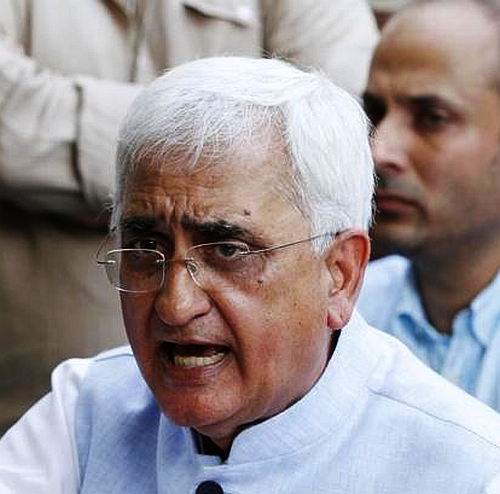 Law Minister Salman Khurshid reacts at the press conference in New Delhi