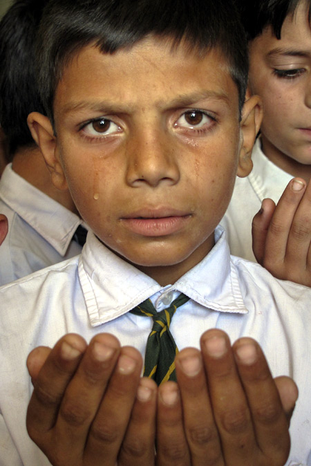 A boy cries as he prays for the speedy recovery of Pakistani schoolgirl Malala Yousufzai.