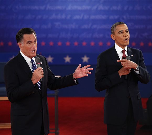 Republican presidential candidate Mitt Romney and US President Barack Obama talk over each other as they answer questions