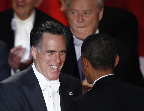 Mitt Romney speaks to Obama on stage at the Alfred E Smith Memorial Foundation dinner in New York