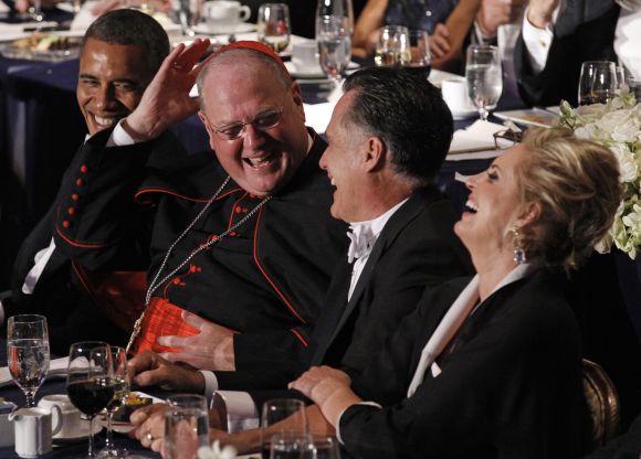 Cardinal Dolan shares a laugh with Obama, Romney and his wife Ann at the Alfred E. Smith Memorial Foundation dinner in New York