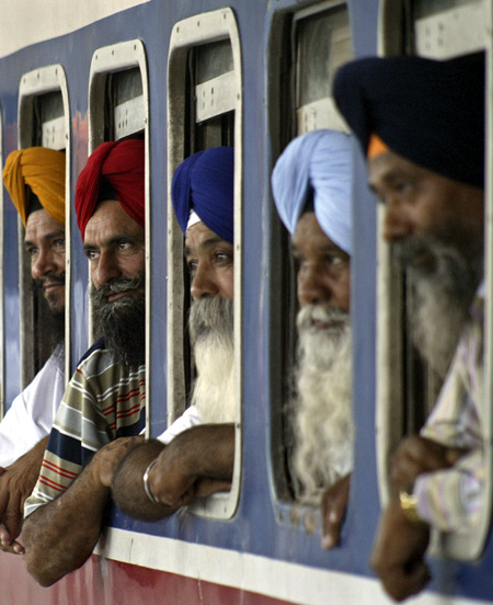 Indian Sikh pilgrims board a train to Pakistan to take part in the Martyrdom Day celebrations of Guru Arjun Dev.