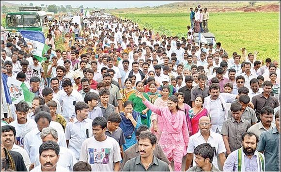Sharmila waves to supports during her ongoing padyatra in Kadapa distict