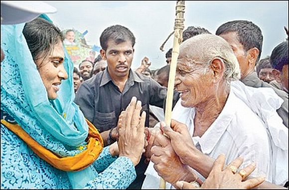 YSR Congress leader Sharmila speaks to an elderly person during her ongoing padyatra