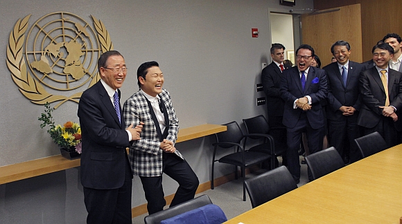Psy practises some 'Gangnam Style' dance steps with United Nations Secretary-General Ban Ki-moon during a photo opportunity at the UN headquarters in New York