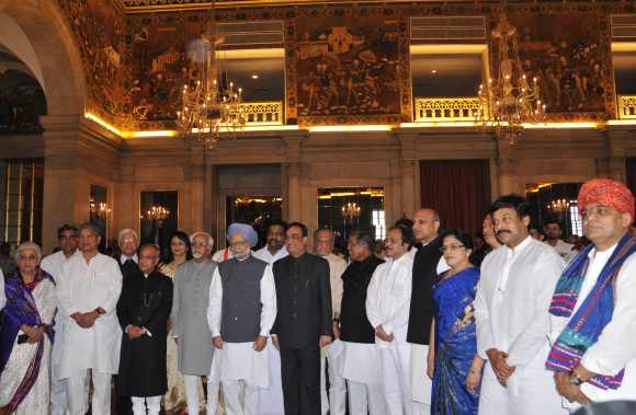 President Pranab Mukherjee, Vice President Hamid Ansari and Prime Minister Dr Manmohan Singh with the newly inducted ministers after a swearing-in ceremony at Rashtrapati Bhavan