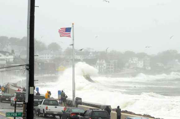 Waves crash over Winthrop Shore Drive as Hurricane Sandy comes up the coast in Winthrop, Massachusetts