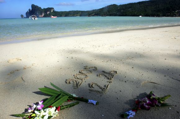 Flowers are laid on a beach during a memorial ceremony marking the one-year anniversary of the Indian Ocean tsunami