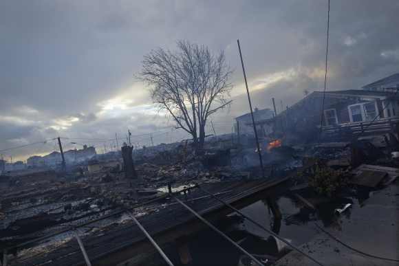 Homes devastated by fire and the effects of Hurricane Sandy are seen the Breezy Point section of the Queens borough of New York.
