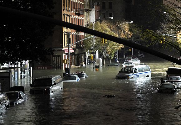 A general view of submerged cars on Ave. C and 7th st, after severe flooding caused by Hurricane Sandy in Manhattan, New York
