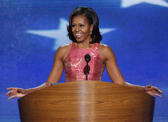 US first lady Michelle Obama smiles as she arrives to address delegates during the first session of the Democratic National Convention in Charlotte, North Carolina
