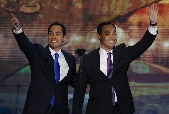 Julian Castro (left), Mayor of San Antonio, Texas, waves with his brother, US Congressional candidate Joaquin Castro, after Joaquin introduced his brother to deliver the keynote address during the first day of the Democratic National Convention in Charlotte, North Carolina