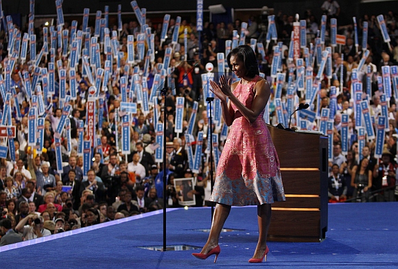 US first lady Michelle Obama applauds after concluding her address to delegates during the first session of the Democratic National Convention in Charlotte, North Carolina