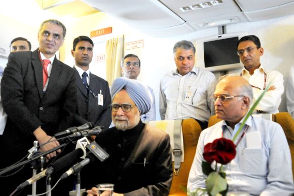 The prime minister briefs the media on board his aircraft while returning from the NAM Summit in Tehran on August 31.