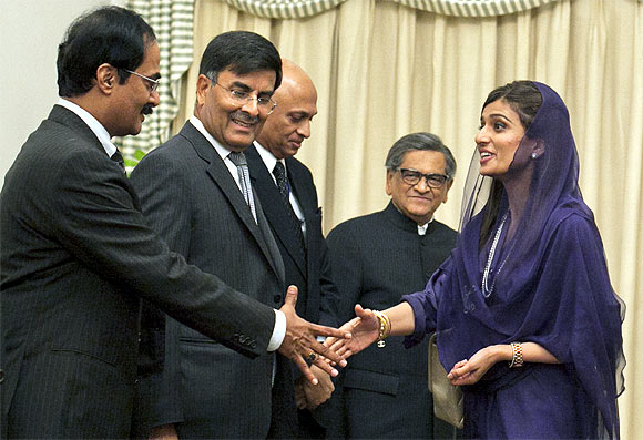 Pakistan's Foreign Minister Hina Rabbani Khar greets the Indian delegation led by Krishna at the prime minister's residence in Islamabad