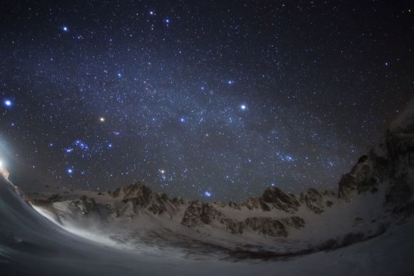 Christmas Stars Diamond: The night sky viewed behind the beautiful Kiso Mountains in Nagano, Japan. The image captures the misty band of the Milky Way and the familiar stars of Orion rise above the peaks to the left of the picture. From left to right the stars Sirius, Betelgeuse and Capella are particularly prominent.