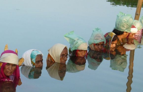 50 protestors in chin-deep water wait to be heard