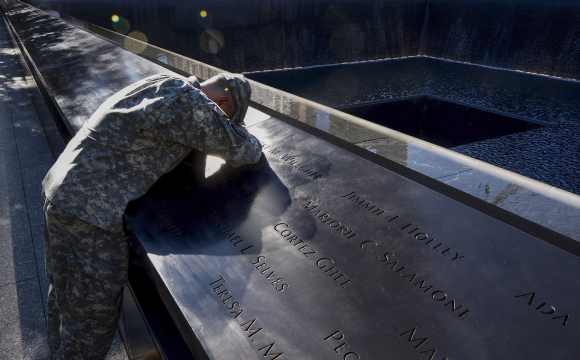 Scott Willens, who joined the US army three days after 9/11, pauses while reflecting by the South Pool on friends he has lost Scott Willens, who joined the United States army three days after the attacks on 9/11, pauses while reflecting by the South Pool on friends he has lost