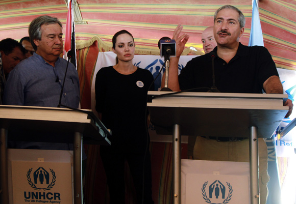 The UN refugee agency's special envoy, actress Angelina Jolie, attends a news conference with U.N. High Commissioner for Refugees (UNHCR) Antonio Guterres (L) and Jordan's Foreign Minister Nasser Judeh (R) at Al Zaatri refugee camp in the Jordanian city of Mafraq.