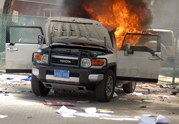 A vehicle burns at the US embassy in Sanaa on September 13, 2012
