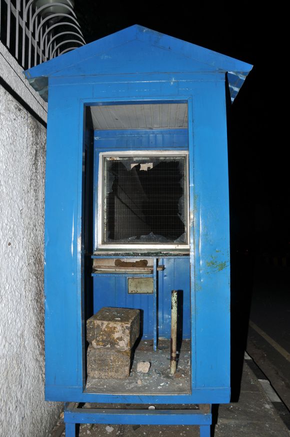 A damaged security cabin at the main entrance of the US consulate in Chennai