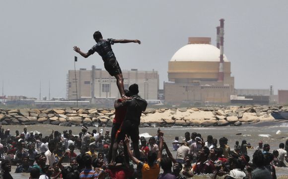 Demonstrators form a human pyramid in the waters of the Bay of Bengal, as they shout slogans during a protest near the Kudankulam nuclear power project