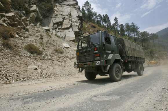 An Indian army truck drives along India's Tezpur-Tawang highway, which runs to the Chinese border, in Arunachal Pradesh