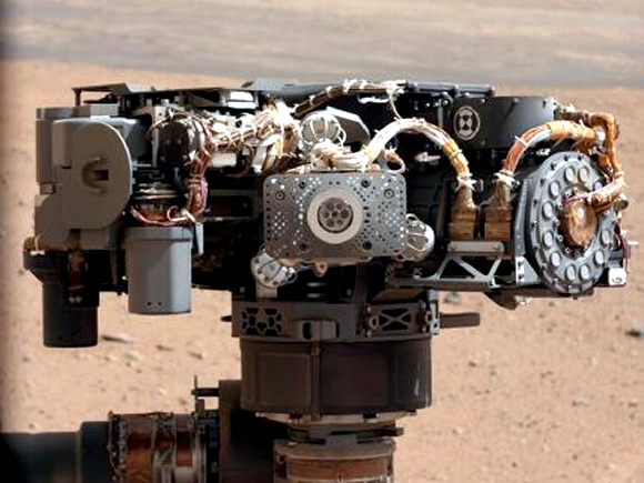 This image shows the Alpha Particle X-Ray Spectrometer on NASA's Curiosity rover, with the Martian landscape in the background